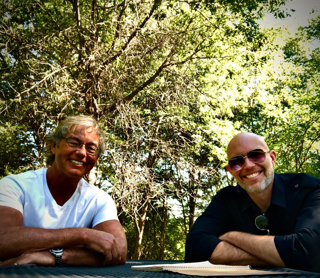 Because of COVID precautions, Brian Kroening (left) and Tom Fugleberg wrote songs together in different public parks including here, Staring Lake Park in Eden Prairie.
