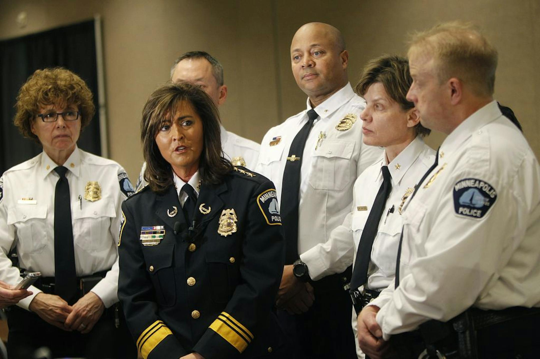 Minneapolis Police Chief Janeé Harteau had her key staff with her as she addressed the media on Tuesday. Behind her, from left: Cmdr. Lucy Gerold, Assistant Chief Matthew Clark, and Deputy Chiefs Eddie Frizell, Kristine Arneson and Travis Glampe.
