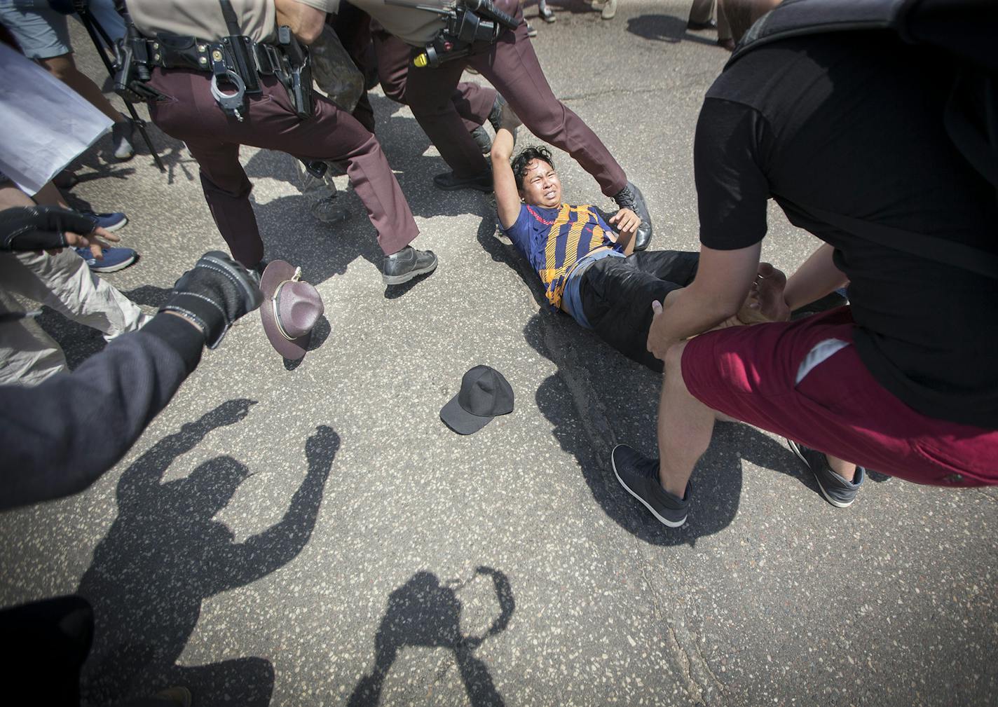 An anti-Sharia law group and antifascist protesters clashed during dueling rallies at the Minnesota State Capitol, Saturday, June 10, 2017 in St. Paul, MN. When a small faction of the anti-sharia group challenged the protesters outside, the Minnesota State Patrol had to intervene. ] ELIZABETH FLORES &#xef; liz.flores@startribune.com