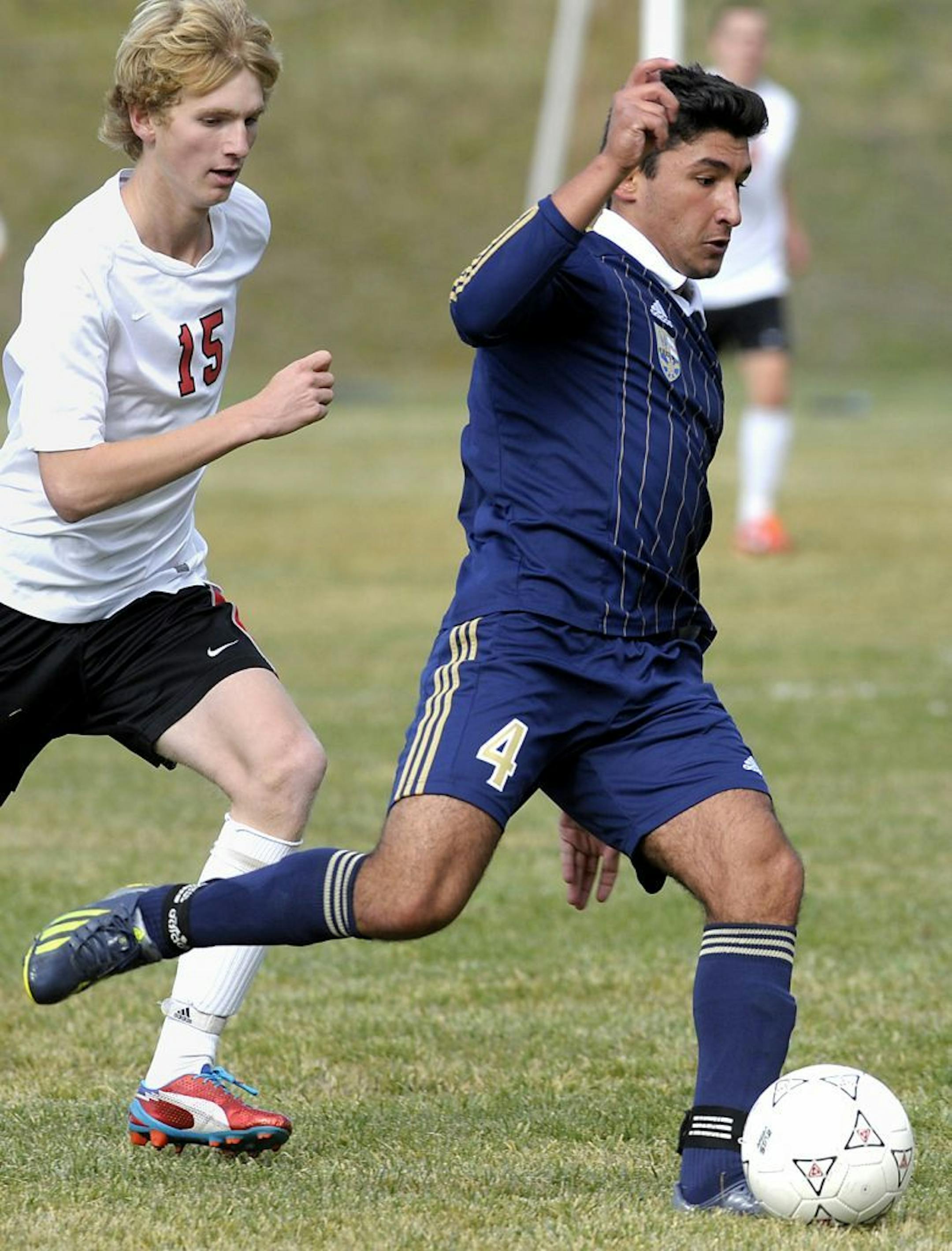 In this Oct. 8, 2013, photo Diren Dede, right, plays in a Big Sky soccer game against Hellgate.