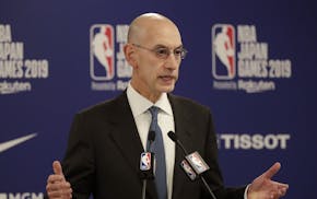 FILE - In this Oct. 8, 2019, file photo, NBA Commissioner Adam Silver speaks at a news conference before an NBA preseason basketball game between the