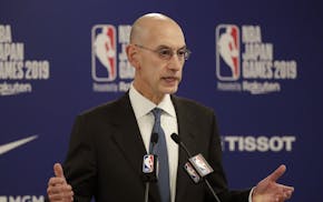 FILE - In this Oct. 8, 2019, file photo, NBA Commissioner Adam Silver speaks at a news conference before an NBA preseason basketball game between the 