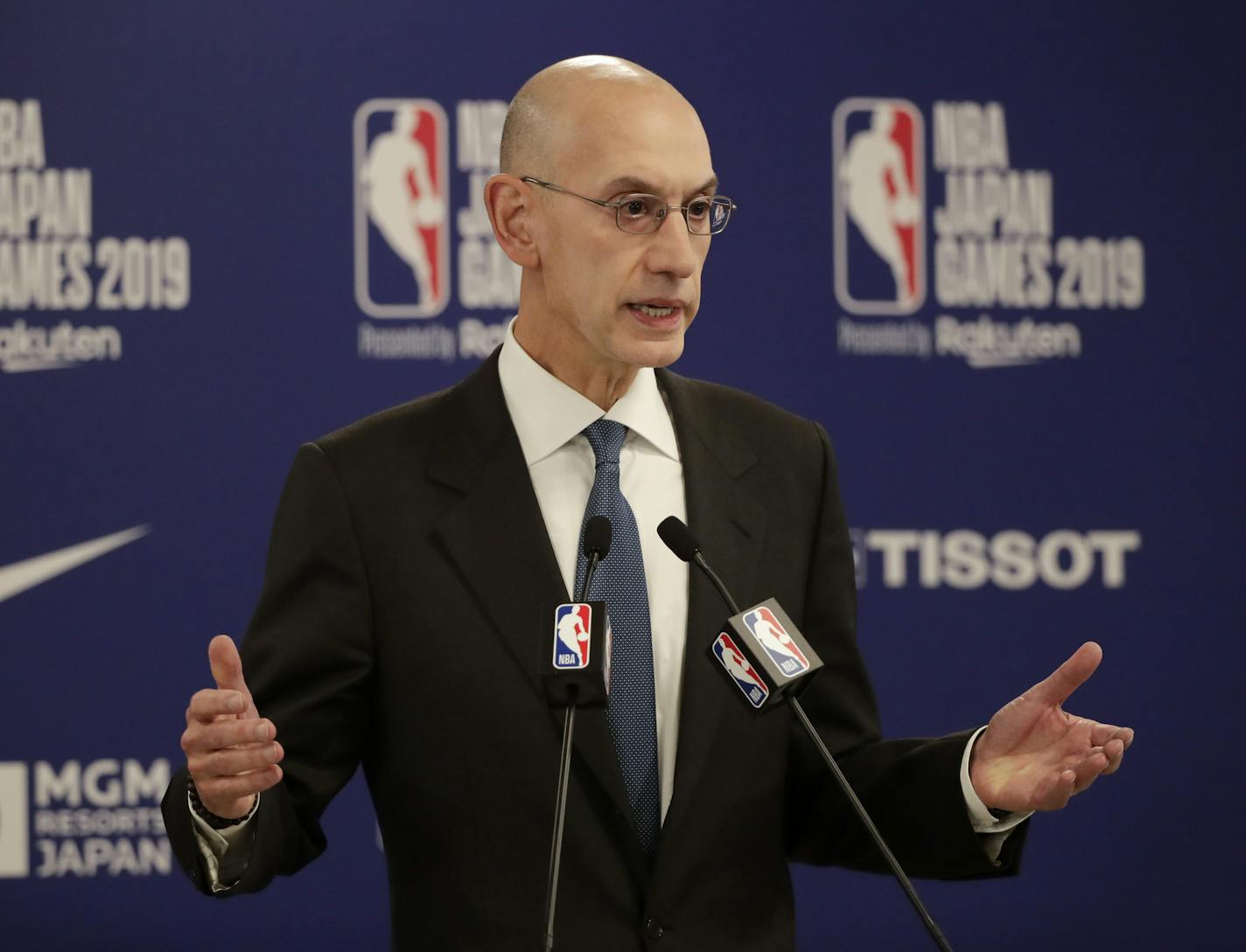 FILE - In this Oct. 8, 2019, file photo, NBA Commissioner Adam Silver speaks at a news conference before an NBA preseason basketball game between the Houston Rockets and the Toronto Raptors in Saitama, near Tokyo. It's been over three months since the commissioners of major sports cancelled or postponed events because of the coronavirus. Enough time for us to grade them on how they've handled the virus so far. (AP Photo/Jae C. Hong, File)