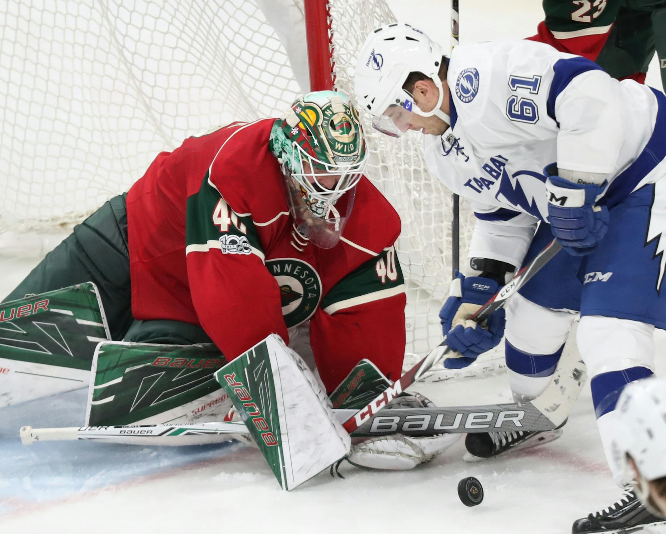 Minnesota Wild goalie Devan Dubnyk (40) makes a save on a shot by Tampa Bay's Gabriel Dumont (61)during the third period of the Wild's 2-1 shootout win Friday, Feb. 10, 2017, at the Xcel Energy Center in St. Paul, MN.
