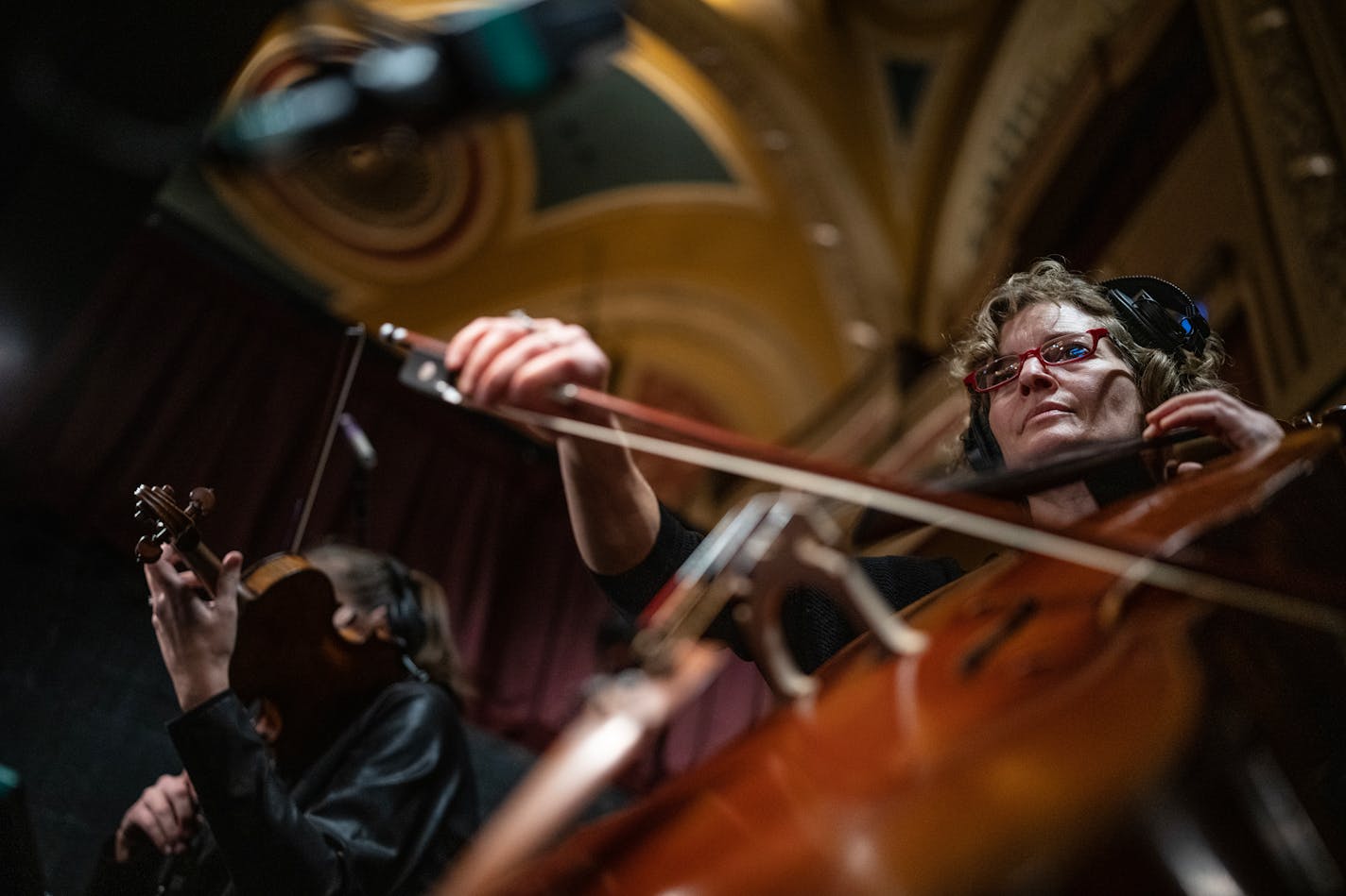 Local musicians Maisie Block left violin and Rebecca Arons cello played during rehearsal with local band members at the Orpheum Theatre Tuesday November14,2023 in, Minneapolis, Minn. ] JERRY HOLT • jerry.holt@startribune.com