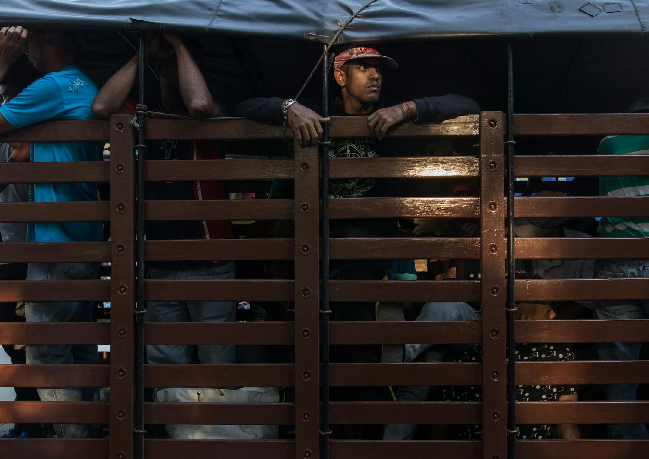 Venezuelans without valid visas are detained in a truck by Colombia police in Cucuta. MUST CREDIT: Photo for The Washington Post by Ivan Valencia ORG XMIT: 126.0.360759263
