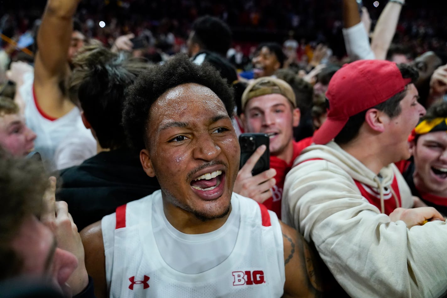 Maryland guard Jahmir Young reacts as students rush the court after Maryland defeated Purdue 68-54 during an NCAA college basketball game, Thursday, Feb. 16, 2023, in College Park, Md. (AP Photo/Julio Cortez)