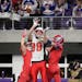 Pequot Lakes defensive back Austin Young (13), left, and defensive back Dylin Ackerman (15), right, broke up a pass in the end zone intended for St. C