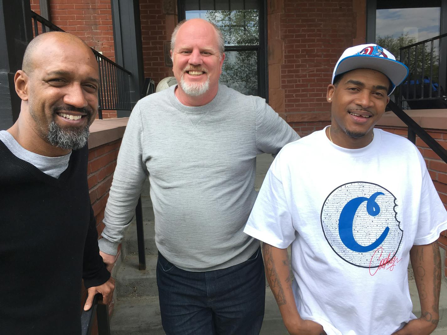 180 Degrees Program Manager Ariel McDonald, left, 180 Executive Director Dan Pfarr, and Chris Harris, a former drug addict who works 80 hours a week at two jobs.