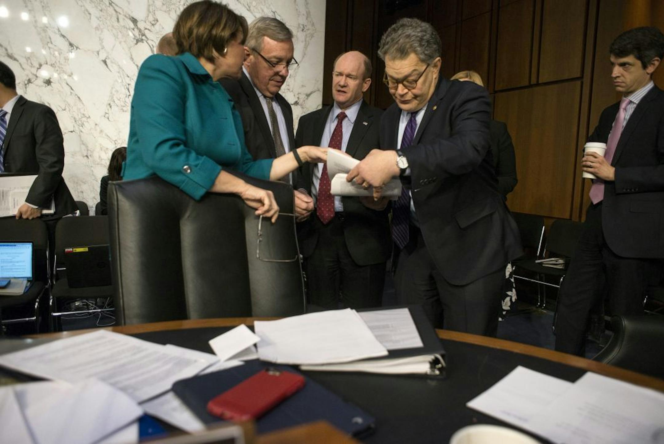 Sen. Dick Durbin (D-Ill.), second left, talks with Sens. Amy Klobuchar (D-Minn.), Christopher Coons (D-Del.) and Al Franken (D-Minn.) before Durbin questioned Judge Neil Gorsuch, President Trump�s nominee for the Supreme Court, of the third day of his confirmation hearing before the Senate Judiciary Committee on Capitol Hill, in Washington, March 22, 2017.