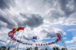 Flags of NATO member countries flap in the wind outside NATO headquarters May 27, 2022.