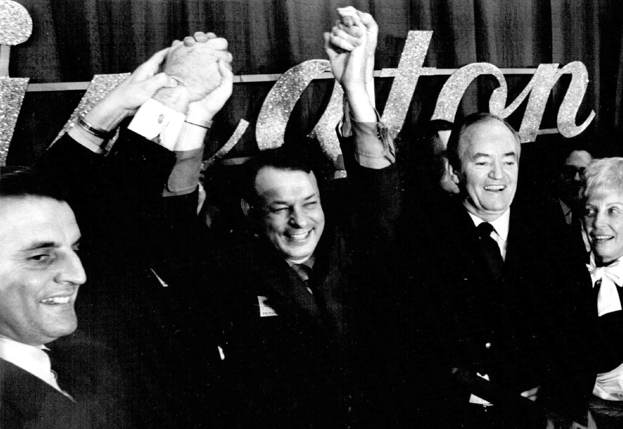 In this Nov. 4, 1970 photo Democratic Farmer Labor Party candidates Rep. Donald Fraser, second from left, and Hubert Humphrey hold each other's hands aloft in a victory sign at the Leamington Hotel in Minneapolis. Sen. Walter F. Mondale, D-Minn., grins at left. Fraser, a former congressman from Minnesota and Minneapolis' longest-serving mayor, has died. He was 95. Son Tom Fraser says his dad died Sunday, June 2, 2019, at his Minneapolis home. (Earl Seubert/Star Tribune via AP)