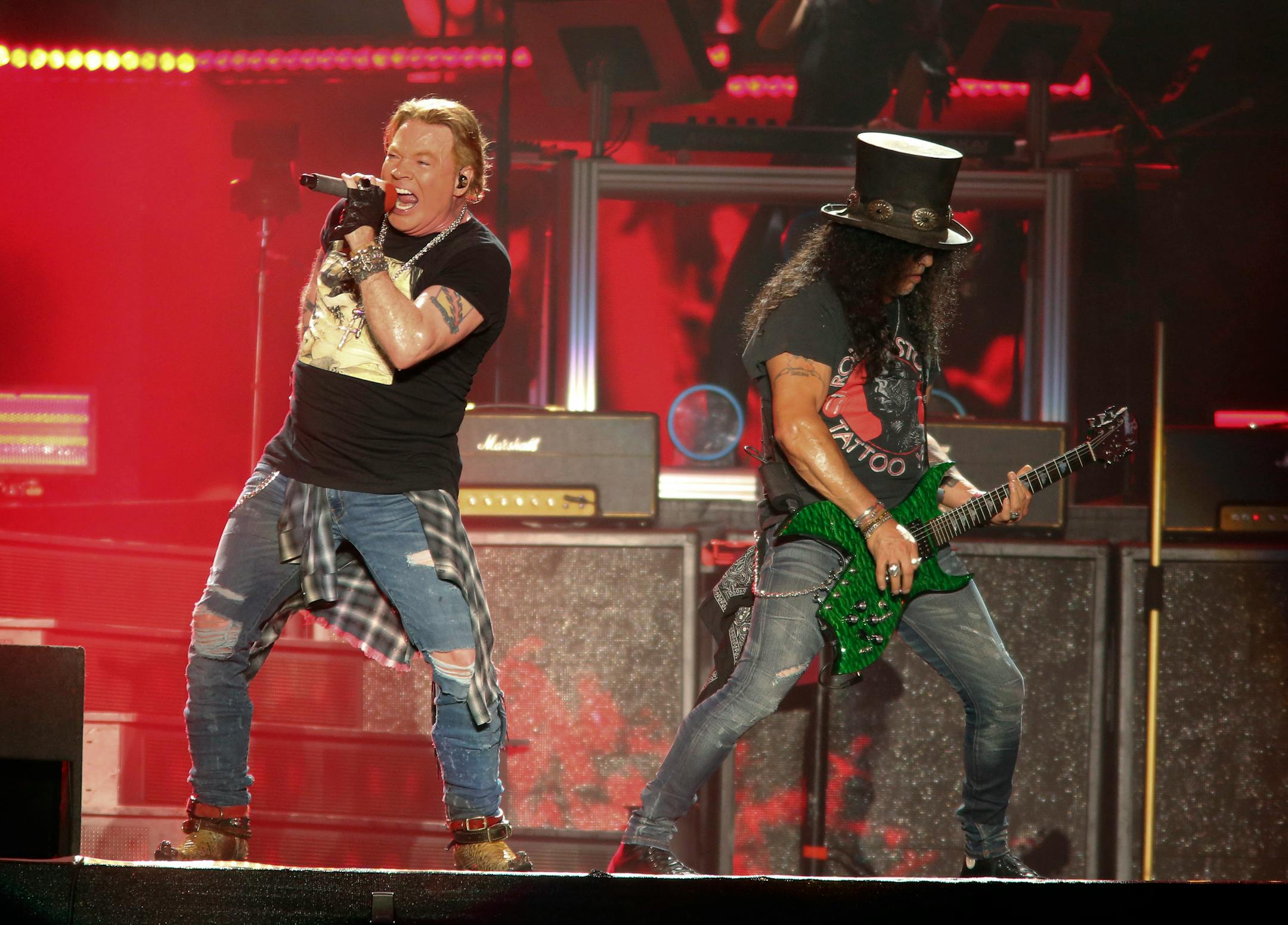 FILE - Guns N' Roses' Axl Rose, left, and Slash perform on the first weekend of the Austin City Limits Music Festival on Oct. 4, 2019, in Austin, Texas. The hard rock band has booked two dates at the Hard Rock casino in Atlantic City, N.J., Sept. 11 and 12. (Photo by Jack Plunkett/Invision/AP)