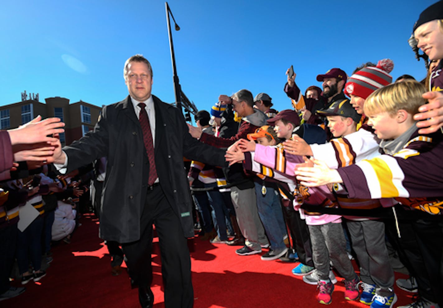 Minnesota Duluth coach Scott Sandelin greeted fans before the 2018 NCAA Frozen Four in St. Paul.