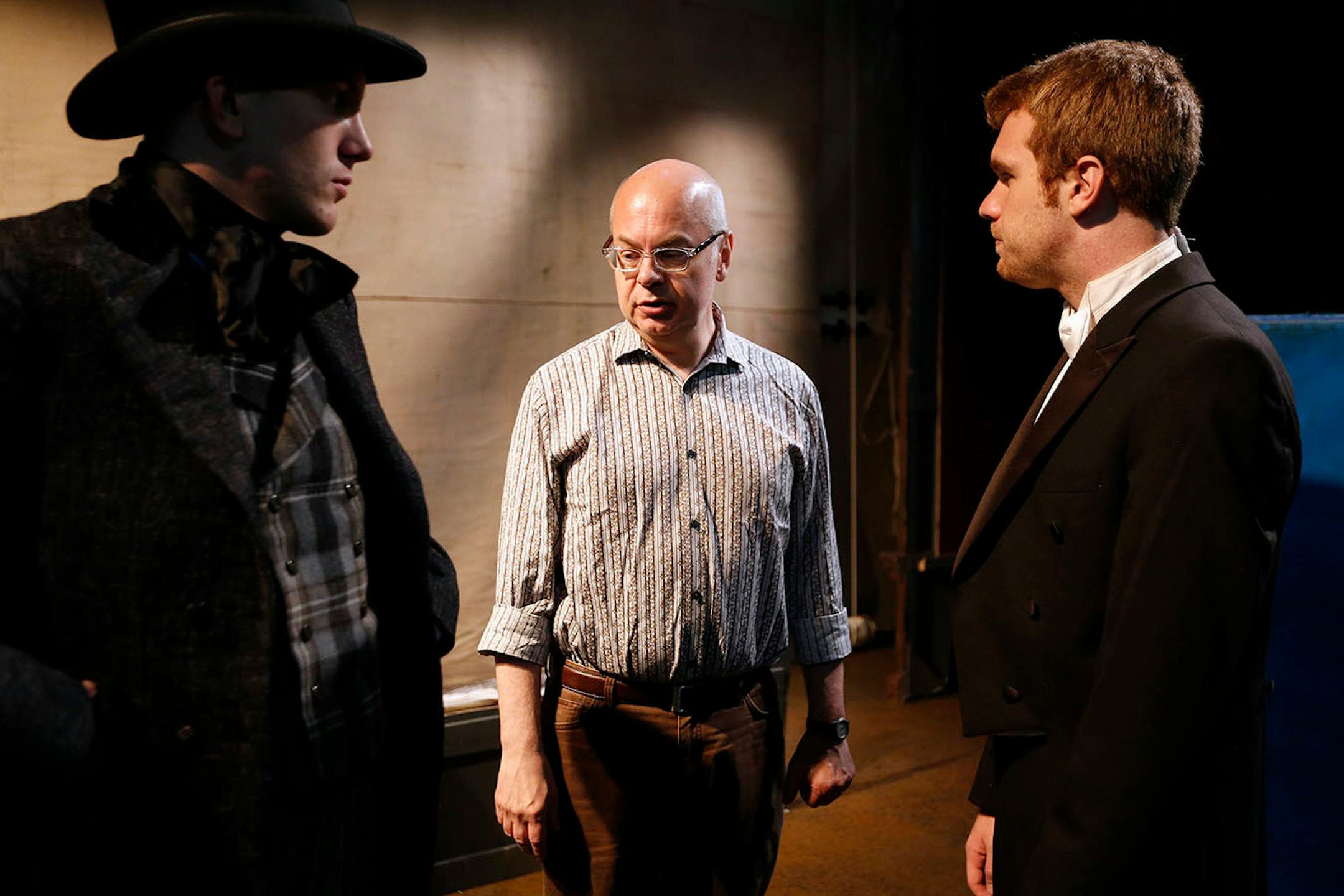 Director John Miller-Stephany, center, talks with actors Corey Quinn Farrell, left, and Bradley Hildebrandt during rehearsal for "Under the Gaslight" on the Minnesota Centennial Showboat.
