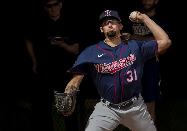 Twins pitcher Devin Smeltzer threw in the bullpen during a spring training workout.