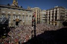 Members of the Castellers Joves Xiquets de Valls form a human tower or "Castellers" during the Saint Merce celebrations in San Jaime square in Barcelo