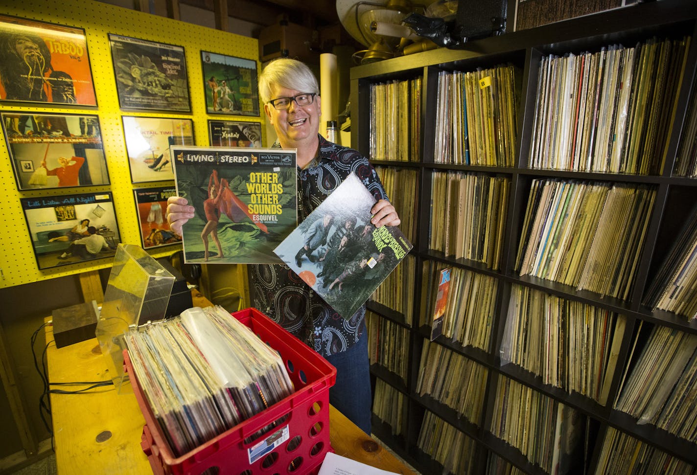 Glen Leslie, host of The Jet Set Planet radio show on KFAI, showed off the first two records he bought at thrift stores, now part of a 6,000-album collection he stores in the basement of his house in New Hope.