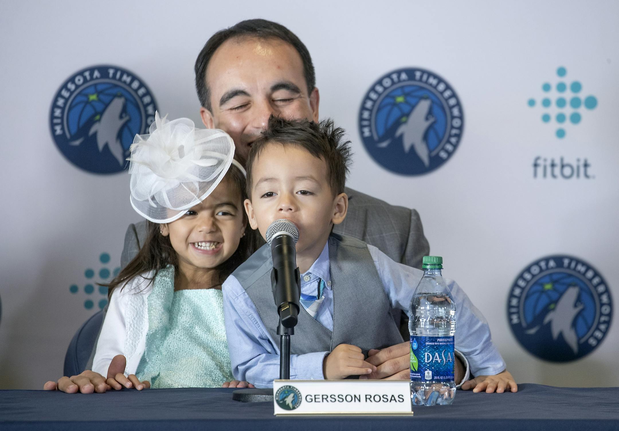 Minnesota Timberwolves new President of basketball operations Gersson Rosas laughed as his 3-year-old twins Giana, left, and Grayson took over the microphone as he addressed the media during a press conference at the Target Center, Monday, May 6, 2019.