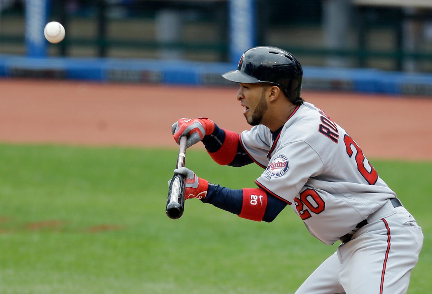 Minnesota Twins' Eddie Rosario bunts against Cleveland Indians starting pitcher Trevor Bauer in the fifth inning of a baseball game, Sunday, May 15, 2016, in Cleveland. Bauer caught the bunt and Rosario was out on the play.