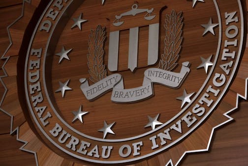Displayed on the wall of the first floor lobby is FBI badge at the new FBI headquarters in Brooklyn Center on Friday March 9, 2012.