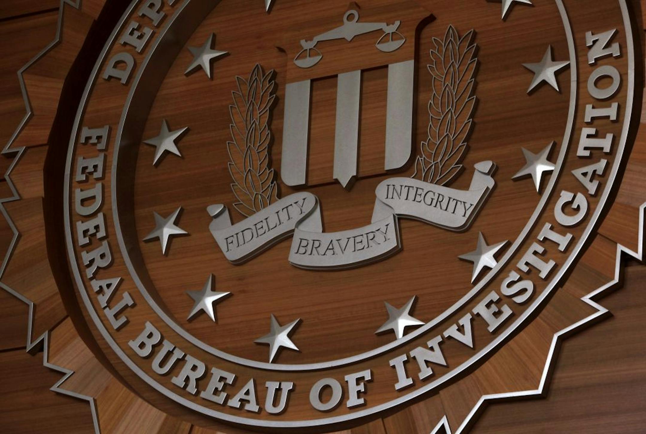 Displayed on the wall of the first floor lobby is FBI badge at the new FBI headquarters in Brooklyn Center on Friday March 9, 2012.
