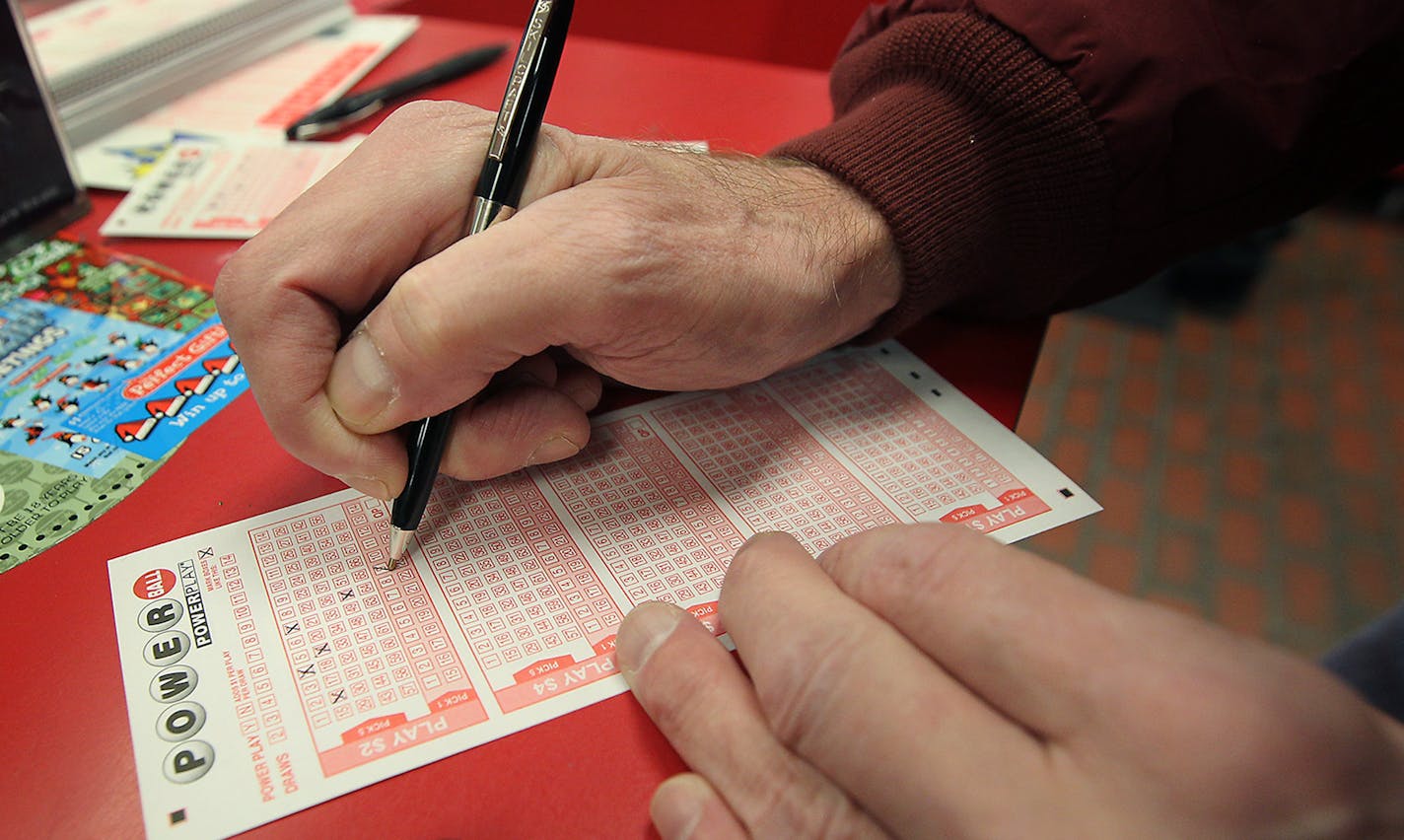 Kevin Hughes filled out a Powerball ticket Friday for purchase at a Northeast Minneapolis Super America.