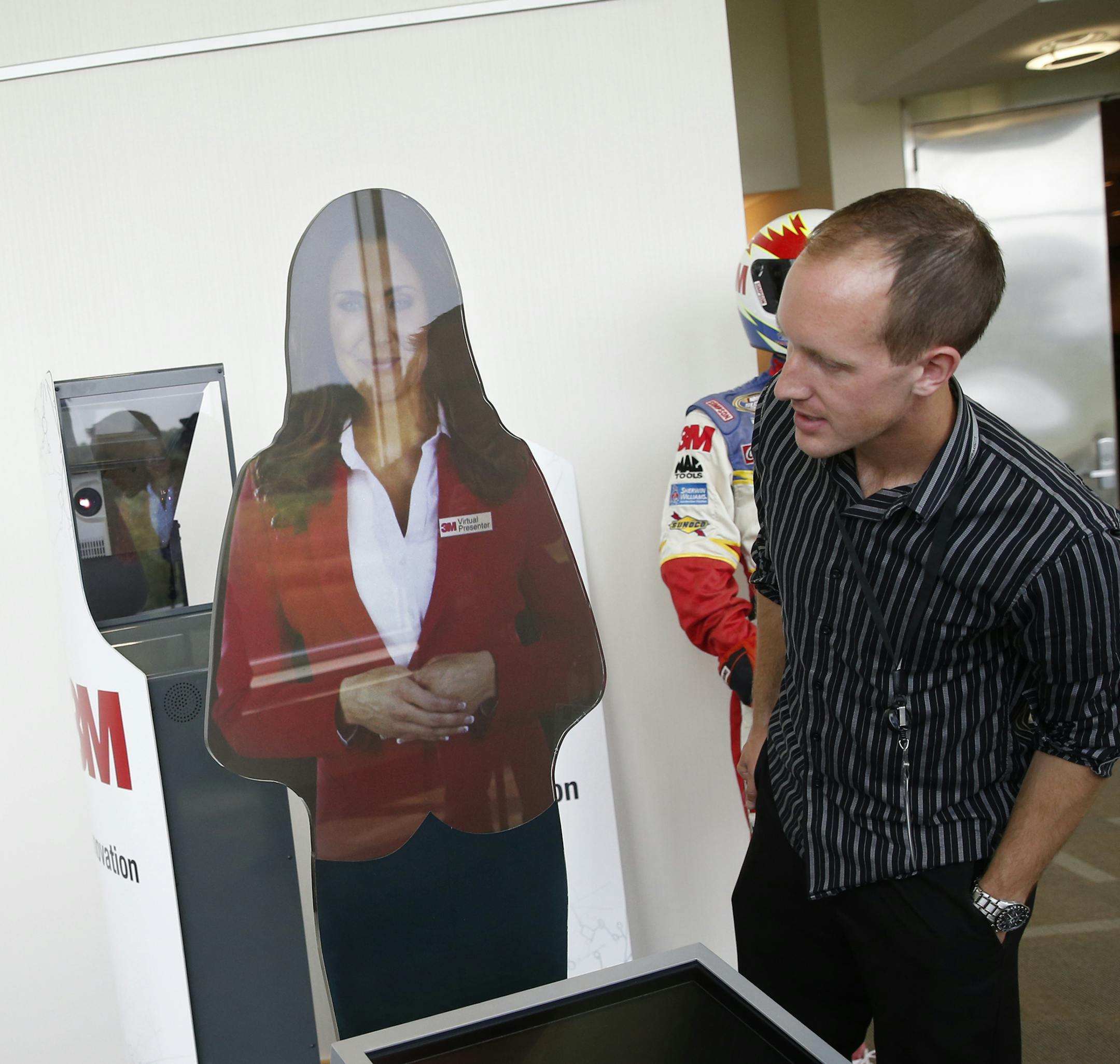 At the 3M Innovation Center in Maple Grove,Bill Hibbard, business development manager showed off a virtual presenter projected on a hi tech screen. On the right is Luke Hafstad, who worked on the project.] tsong-taataarii@startribune.com