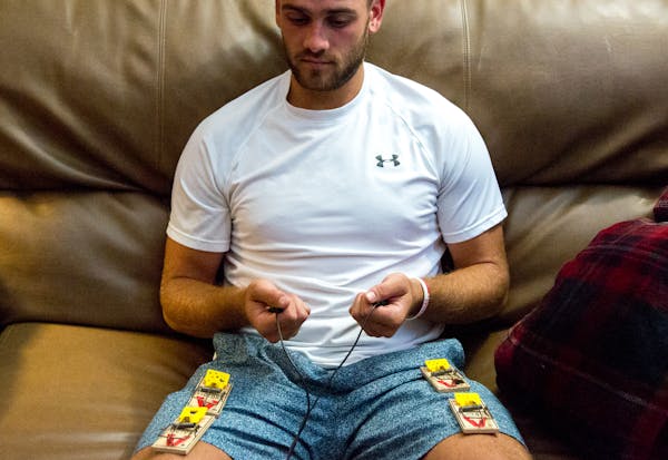 Hockey player Christian Horn, working with mental skills coach Hans Skulstad, sat with mouse traps on his legs to simulate a stressful situation durin