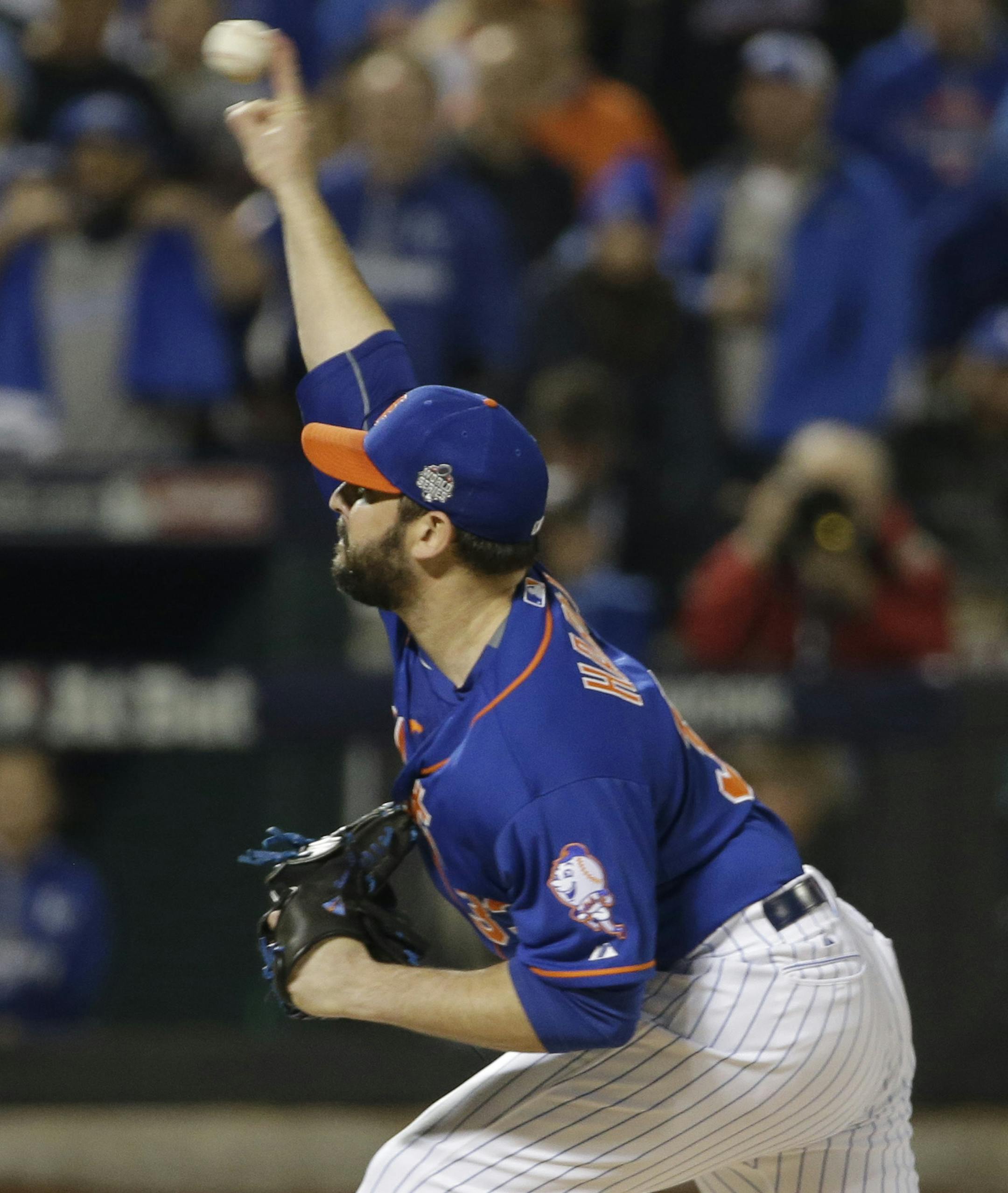 New York Mets pitcher Matt Harvey throws during the first inning of Game 5 of the Major League Baseball World Series against the Kansas City Royals Sunday, Nov. 1, 2015, in New York. (AP Photo/David J. Phillip)