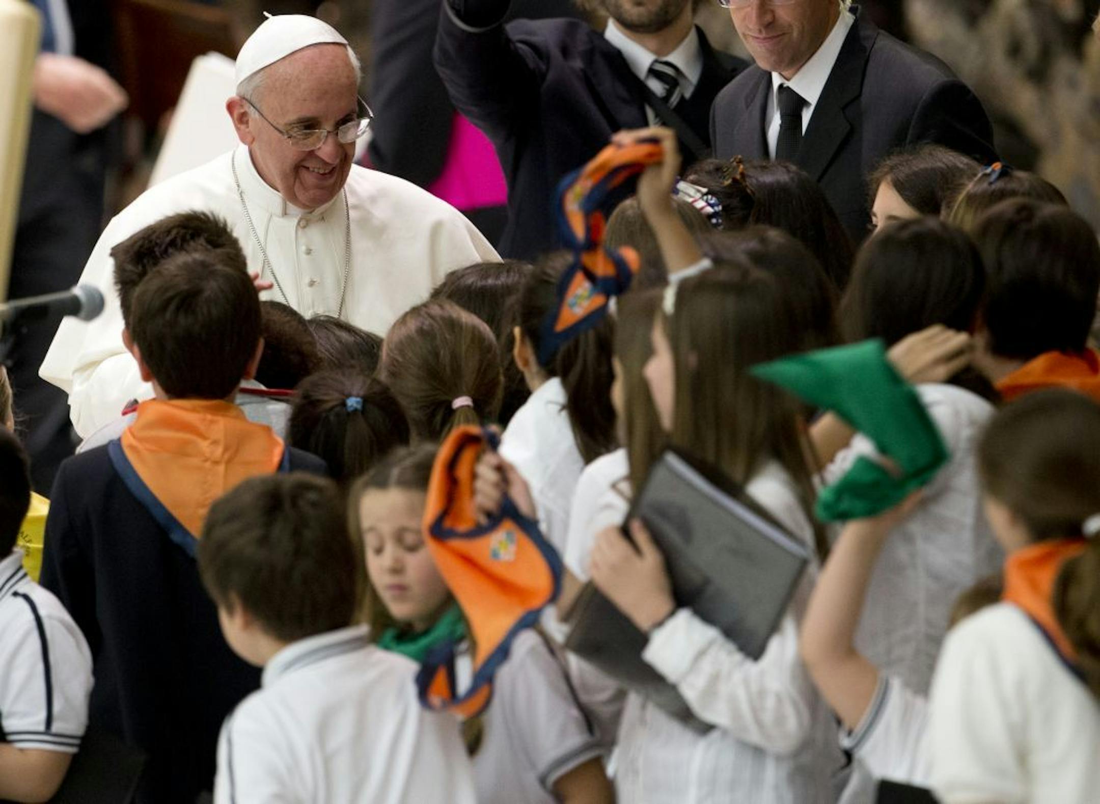 Pope Francis greets youths during an audience with students of Jesuit schools and institutions in Italy and Albania, at the Vatican, Friday, June 7, 2013. During the audience, answering a child's question, Francis revealed that he never wanted to be pope and that he's living in the Vatican hotel for his "psychiatric" health. Francis got very personal Friday as he met with thousands of children from Jesuit schools and answered their questions one by one.