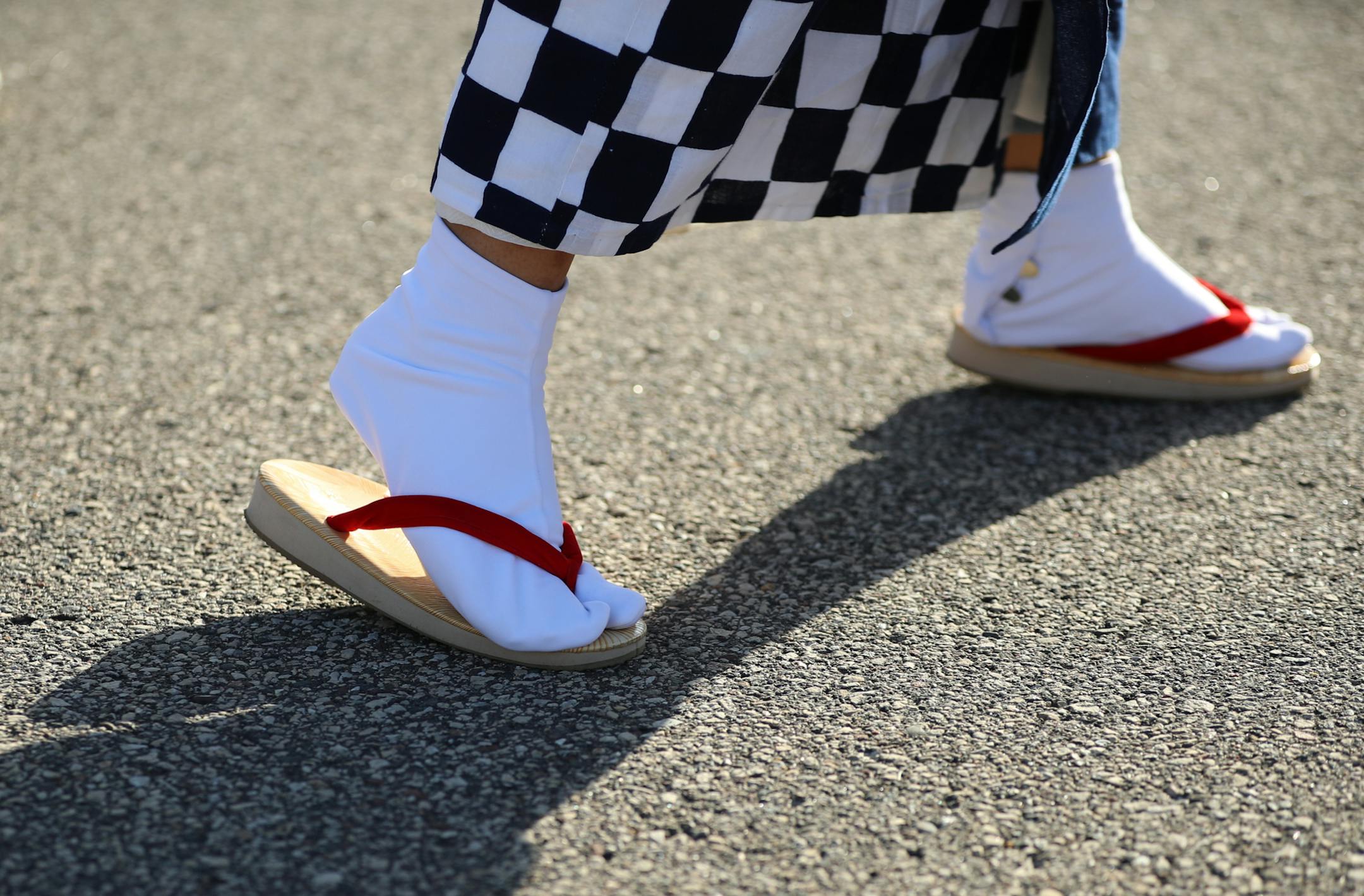 Detail of the feet of a member of the Sansei Yonsai Kai dance company of Roseville as they performed Sunday afternoon as part of the Japanese Lantern Lighting Festival at Como Conservatory.