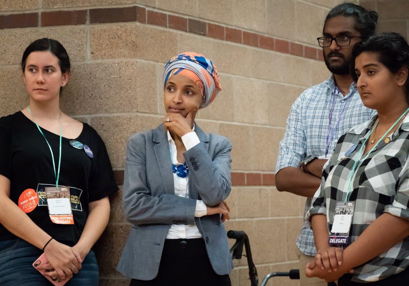 Rep. Ilhan Omar listened as State Sen. Patricia Torres Ray spoke. After the first ballot put State Sen. Patricia Torres Ray far behind Rep. Ilhan Omar, Torres Ray huddled with supporters in a back stairwell. She then asked to speak to the convention for what convention co-chair Jen Guertin was told was for her to withdraw from the race. Instead she vowed to keep fighting. Omar won the DFL endorsement by 68 percent on the next ballot.