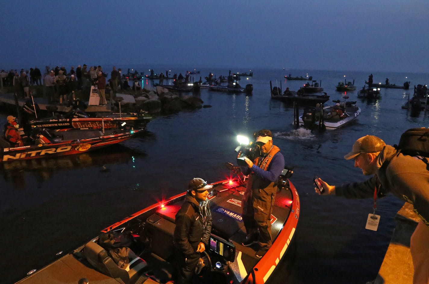 Bassmaster Angler of the Year points leader Brandon Palaniuk of Hayden, Idaho, is interviewed live on social media prior to takeoff on Mille Lacs on the first of three days of competition this week that concludes Sunday.