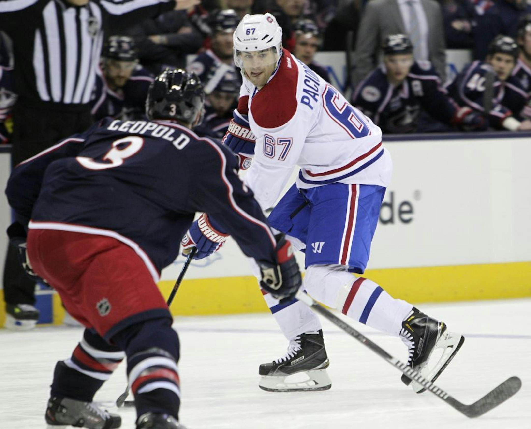 Montreal Canadiens' Max Pacioretty, right, looks for an open pass as Columbus Blue Jackets' Jordan Leopold defends during the third period of an NHL hockey game Thursday, Feb. 26, 2015, in Columbus, Ohio. The Canadiens won 5-2.
