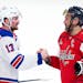 Rangers left wing Alexis Lafrenière (13) shakes hands with Capitals left wing Alex Ovechkin (8) following New York's sweep Sunday.