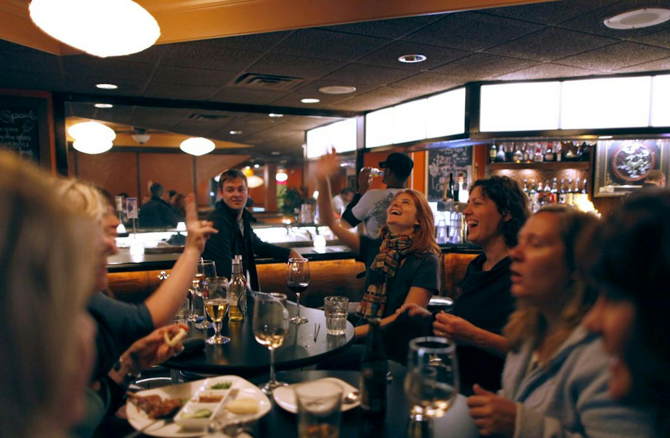 A group of friends met for a cocktail at the lounge at Senor Wong in St. Paul.