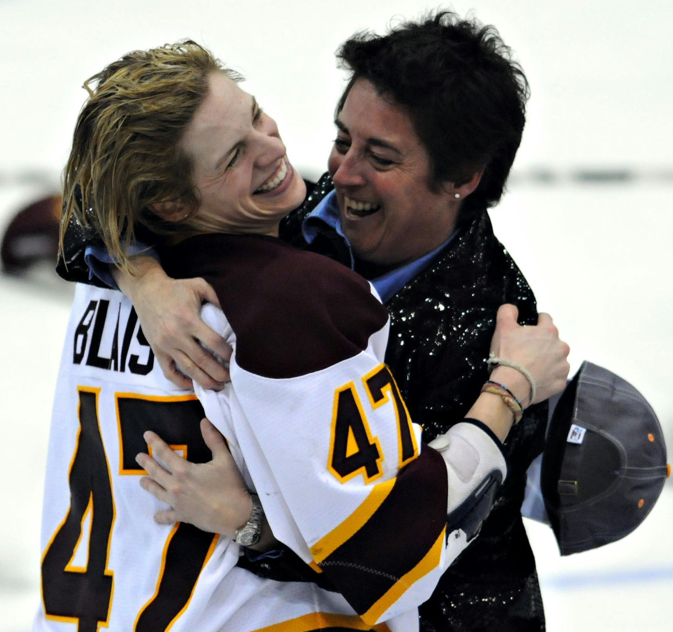 Minnesota-Duluth's Emmanuelle Blais celebrates with head coach Shannon Miller after defeating Cornell 3-2 after the third overtime at the NCAA Women's Frozen Four championship hockey game Sunday, March 21, 2010, at Ridder Arena in Minneapolis. Minnesota-Duluth defeated Cornell 3-2. (AP Photo/Dawn Villella) ORG XMIT: MNDV105