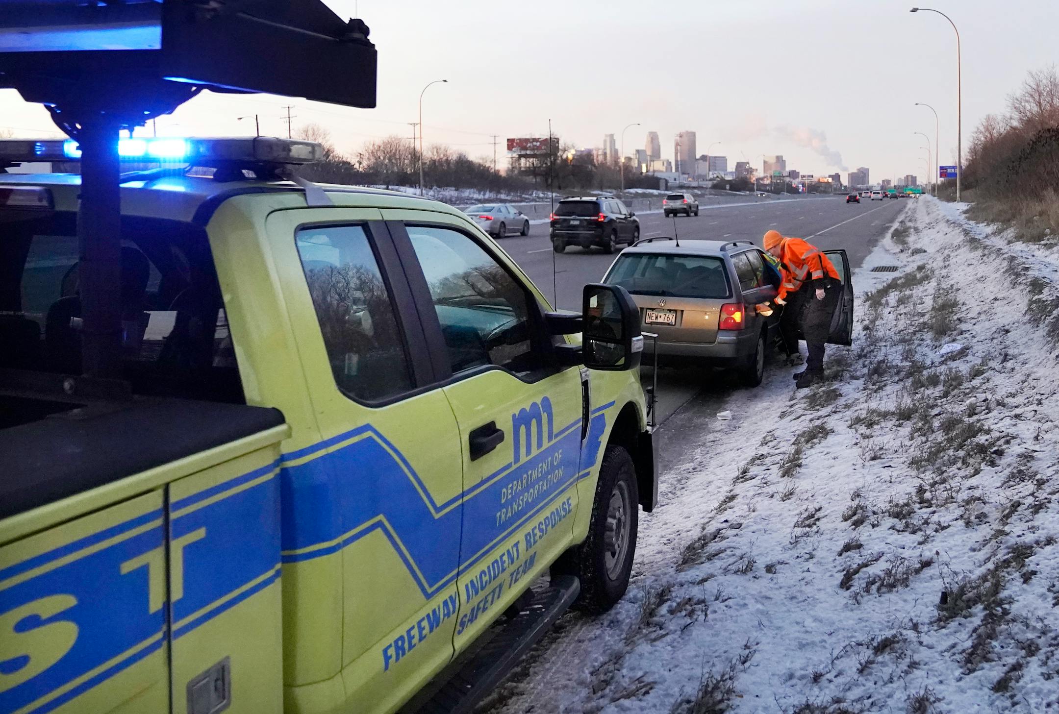 Mike Ahlman, a driver for MnDOT's Freeway Incident Response Safety Team, assisted a motorist who ran out of gas on Interstate 94.