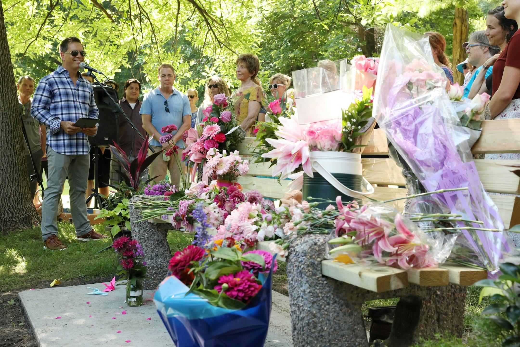 Don Damond spoke to the crowd of friends and family that gathered to dedicate a bench to Justine Ruszczyk Damond at Minnehaha Creek between 53rd and 54th streets on the one year anniversary of her death.