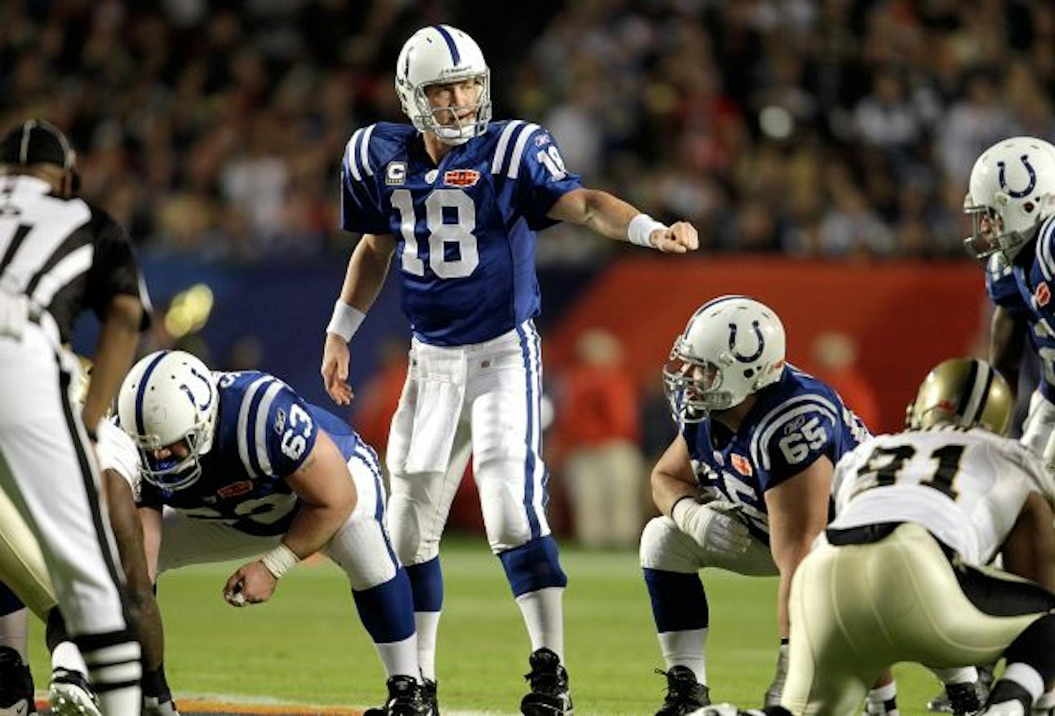 Indianapolis Colts quarterback Peyton Manning makes a play call from the line as the New Orleans Saints face the Indianapolis Colts, Sunday, February 7, 2010 in Super Bowl XLIV at Sun Life Stadium in Miami Gardens, Florida.