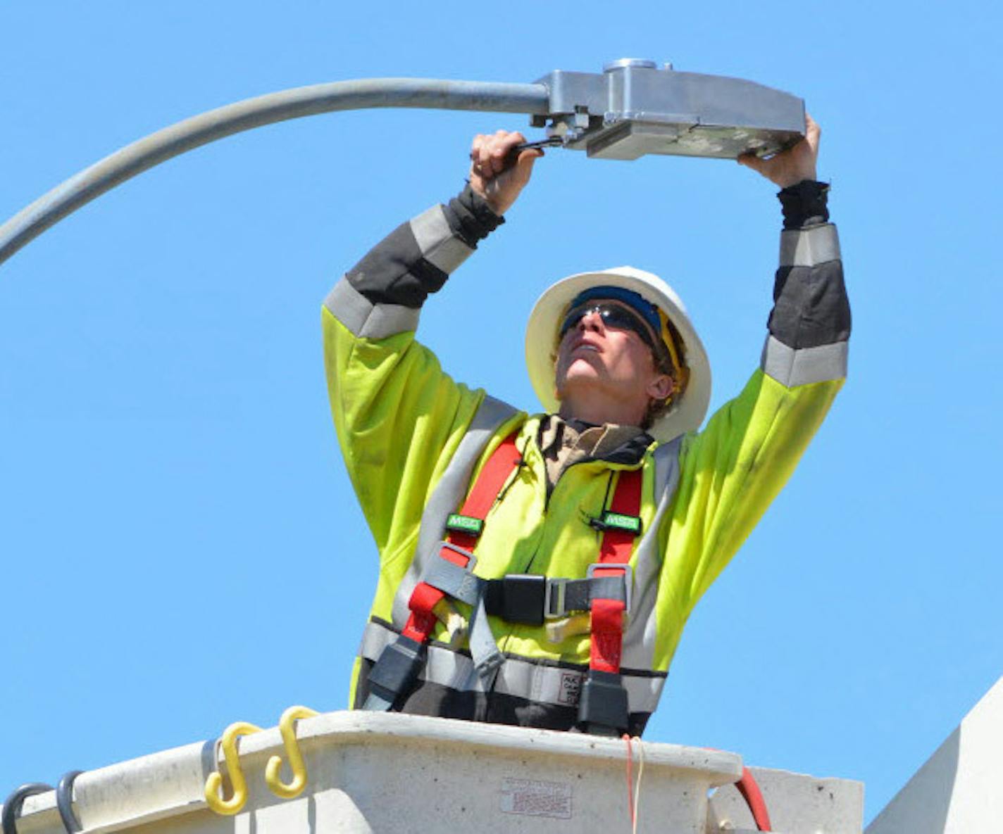 Lyon-Lincoln Electric Coop Lineman Dan Tutt installs an LED Street Light in Russell, Minn., in 2014. More cities are saving money and improving night lighting with LEDs, In this project, by a rural power cooperative, 102 streetlights were changed. On Thursday, Xcel Energy, the state's largest power company, said it will change 100,000 streetlights to LEDs over five years.