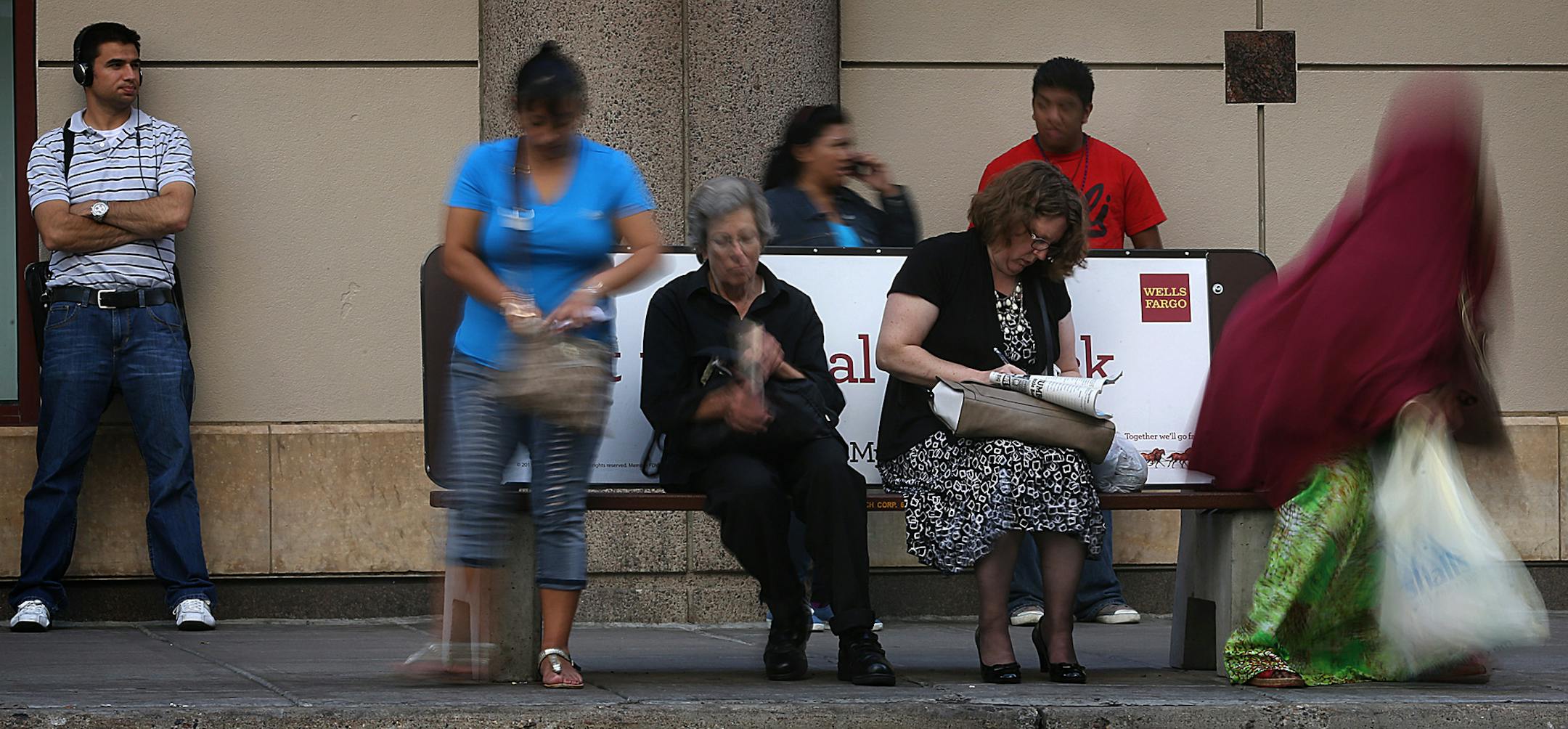 People waited for busses on the corner of S. 6th St. and Nicollet Mall, where one of many concrete bus benches is located. ] JIM GEHRZ ‚Ä¢ jgehrz@startribune.com / Minneapolis, MN / August 26, 2014 / 4:00 PM / BACKGROUND INFORMATION: The lowly concrete bus bench, a forgettable element of the urban streetscape, is a money maker for a Twin Cities company that has had a monopoly on the service for more than 50 years. U.S. Bench, based in Minneapolis, holds all 700 renewable bench l