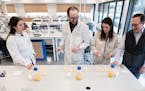 SunOpta CEO Joe Ennen, right, watched as food scientists evaluated samples of a pumpkin oat beverage, Tuesday, March 29, 2022, Eden Prairie, Minn. ] G