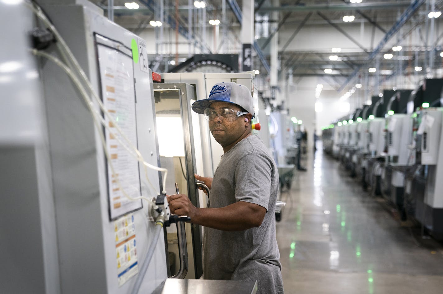 CNC mill operator Anthony Robinson works inside the Protolabs manufacturing facility. CNC stands for computer numerical control. ] LEILA NAVIDI &#xa5; leila.navidi@startribune.com BACKGROUND INFORMATION: The Protolabs manufacturing facility in Brooklyn Park on Monday, February 25, 2019.