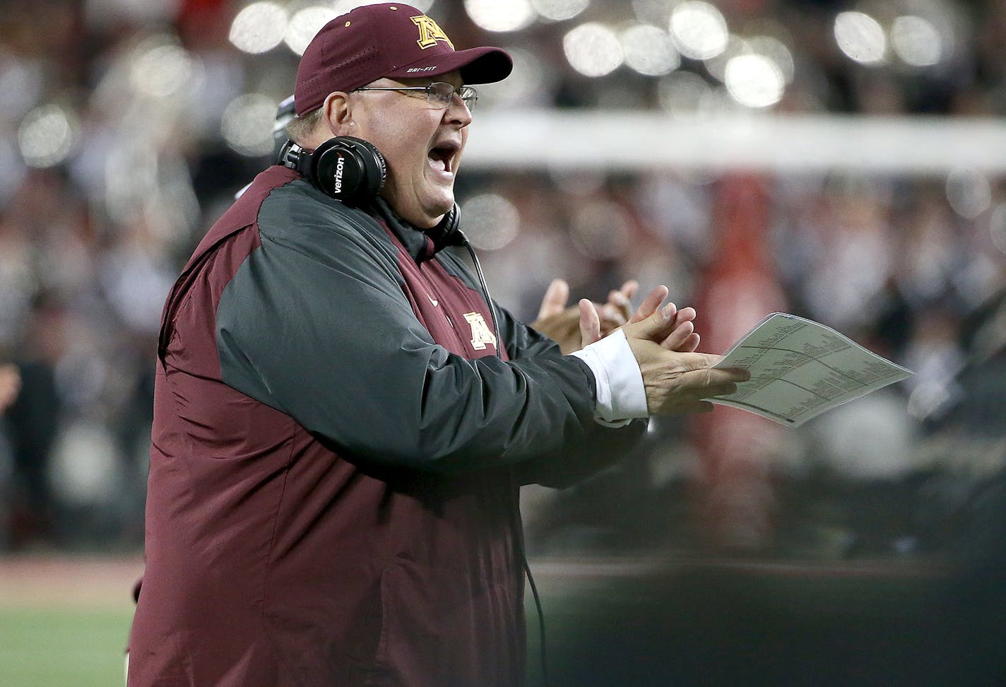 Interim head coach Tracy Claeys cheered on his players in the third quarter as the Minnesota Gophers took on the Ohio State Buckeyes.