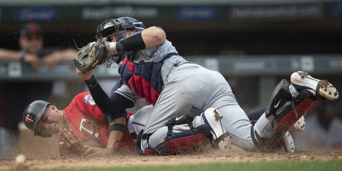 Cleveland Indians catcher Kevin Plawecki (27) tagged out Twins pinch runner Ehire Adrianza (13) as he tried to score on a double by Marwin Gonzalez in the ninth inning at Target Field Sunday August 11, 2019 in Minneapolis, MN.] The Cleveland Indians beat the Minnesota Twins 7-3 in ten innings at Target Field. Jerry Holt &#x2022; Jerry.holt@startribune.com