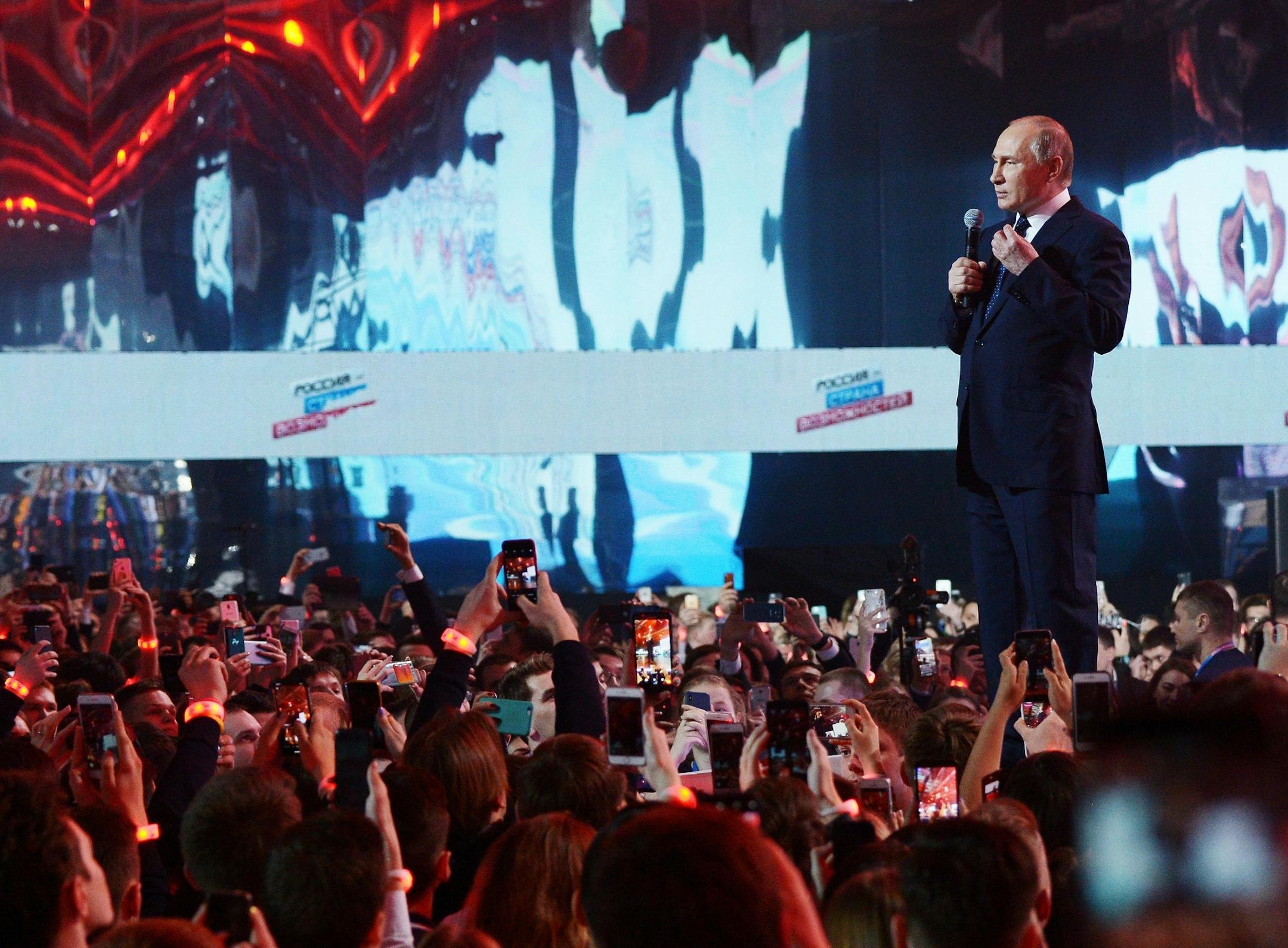 Russian President Vladimir Putin gestures while speaking at a youth forum "Russia, Land of Opportunity" in Moscow, Russia, Thursday, March 15, 2018. (Alexei Nikolsky, Sputnik, Kremlin Pool Photo via AP)