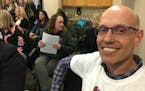 John Sheridan-Giese, who has four children at East Union Elementary, joined a crowd of about 50 at the Eastern Carver County School District meeting i