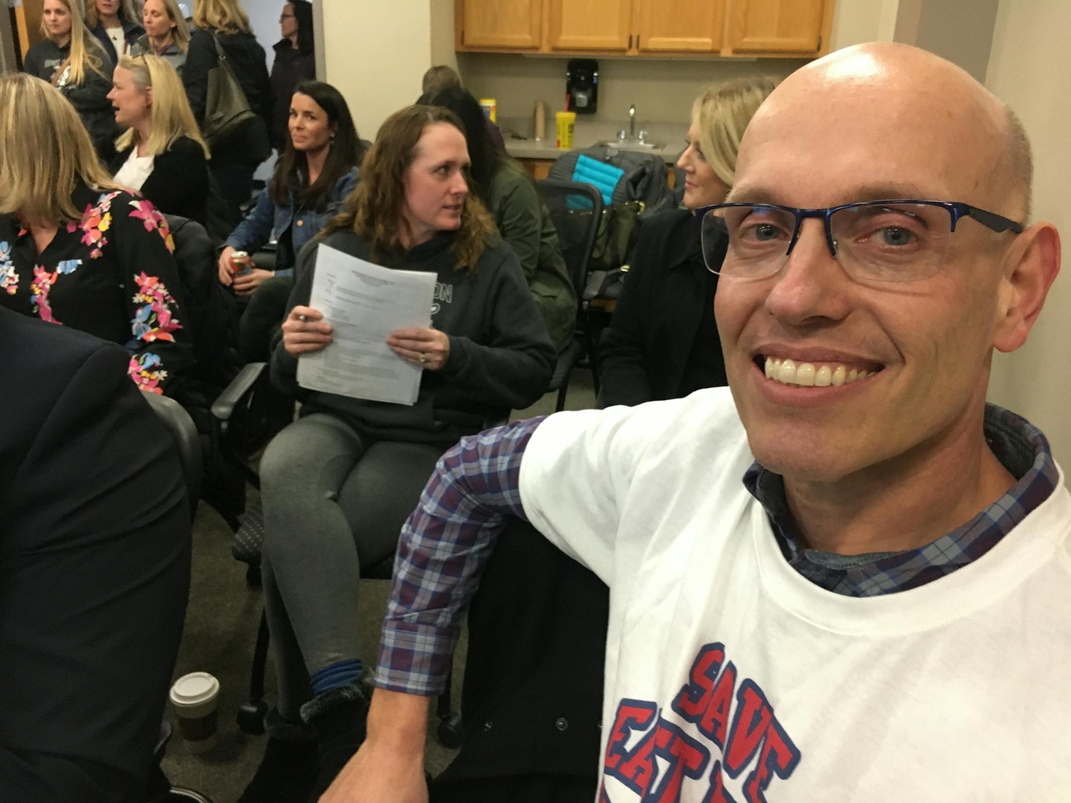 John Sheridan-Giese, who has four children at East Union Elementary, joined a crowd of about 50 at the Eastern Carver County School District meeting in Chaska on Monday, Feb. 24. He has helped lead the effort to keep the school open, despite the districtÕs cost-cutting. Photo by Katy Read.